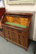 A continental mahogany cylinder bureau,