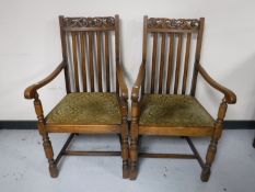 A pair of oak carver armchairs CONDITION REPORT: One chair with split forming in