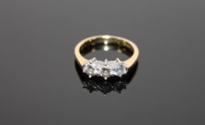 An 18ct gold three stone diamond ring,