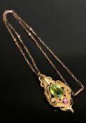 An superb quality antique 15ct gold peridot and ruby pendant with chain
