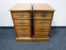 A pair of Edwardian mahogany four drawer chests