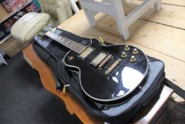 A vintage Jedson Les Paul style guitar in carry bag