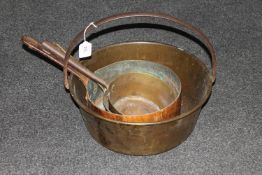 A brass jam pan together with three antique copper and brass sauce pans