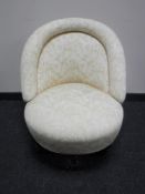 A Victorian spoon back bedroom chair in floral fabric and a footstool