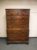 A George III mahogany eight drawer double chest on bracket feet,