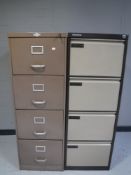 Two four drawer metal filing cabinets with keys