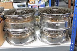 Four vintage car wheels