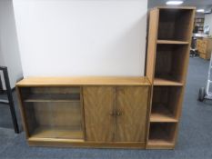 A mid 20th century sliding door bookcase and a set of teak open shelves