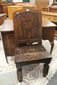 An antique walnut hall chair