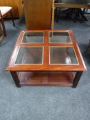 A two tier coffee table in a mahogany finish