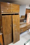 A three piece mid 20th century melamine bedroom suite (triple door dismantled wardrobe,
