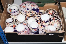 A box containing early 20th century Imari pattern tea china