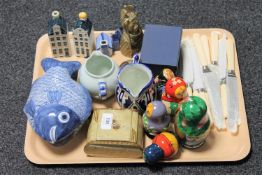 A tray of china and collectables including Russian dolls, KLM houses etc.