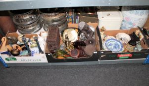 Three boxes containing oriental hardwood stands, treen, candlesticks, table lamps,