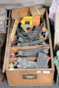 A pine box containing mid twentieth century Trix twin railway rolling stock,