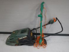 A Black & Decker electric mower with box and a strimmer