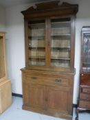 An Edwardian oak secretaire bookcase