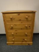 A pine four drawer chest,