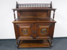 An Edwardian oak buffet back sideboard