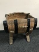 An oak coopered barrel plant trough on stand