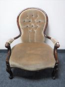 A mahogany spoon back chair upholstered in a button dralon fabric