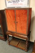 An antique style studded cabinet on stand,