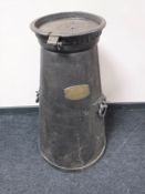 A nineteenth century cast iron milk churn, with brass plaque 
