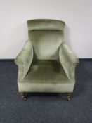 A mahogany armchair in green dralon