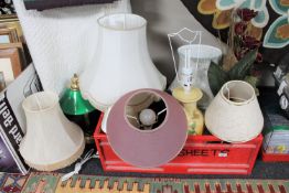 Nine assorted table lamps together with a Christmas floral decoration