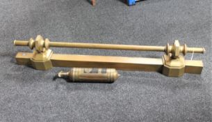A vintage Pyrene fire extinguisher and a brass fire curb
