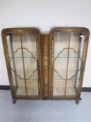 A walnut Chinoiserie glazed display cabinet