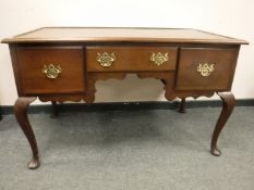 A Georgian style three drawer desk,