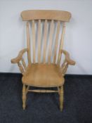 A pine farmhouse kitchen armchair