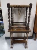 A nest of two mahogany glass topped tables and a rush seated stool