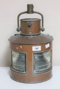A copper ship's light stamped 1942 CONDITION REPORT: There is no burner or a later
