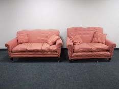 A pair of early 20th century three and two seater settees in a pink fabric