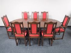 An oval oak Old Charm extending table with leaf and eight dining chairs