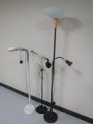 Two angle poised reading lamps and an up-lighter