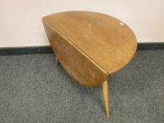 A small Ercol elm flap sided table,
