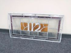 An unframed leaded stained glass window