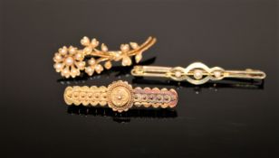 Three 15ct gold brooches, two set with pearls, 8.