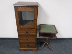A reproduction oak audio cabinet and a wine table