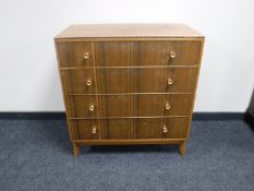 A mid 20th century teak four drawer chest