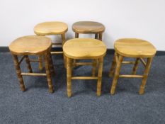A set of five pine stools