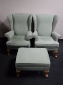 A pair of wing back armchairs in green fabric and matching footstool