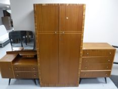 A teak three piece bedroom suite
