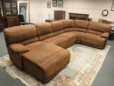 A contemporary five seater brown suede reclining corner suite