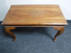 An Eastern mahogany coffee table with brass inlay