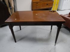 A mahogany pull out dining table