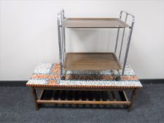 A 1970's teak mosaic tiled coffee table and a chrome framed folding serving trolley
